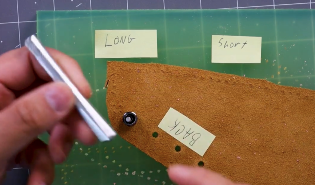 Gather the eyelet setting punch, eyelet setting base, and a packet of eyelets in your preferred color.