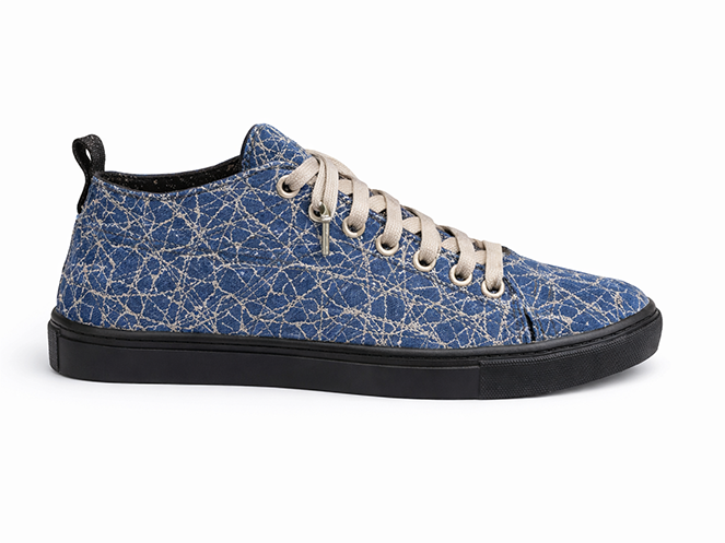 Blue Crackle Quilted Sneaker Blue quilted sneaker with crackle pattern texture, beige laces, black sole, and low-top profile