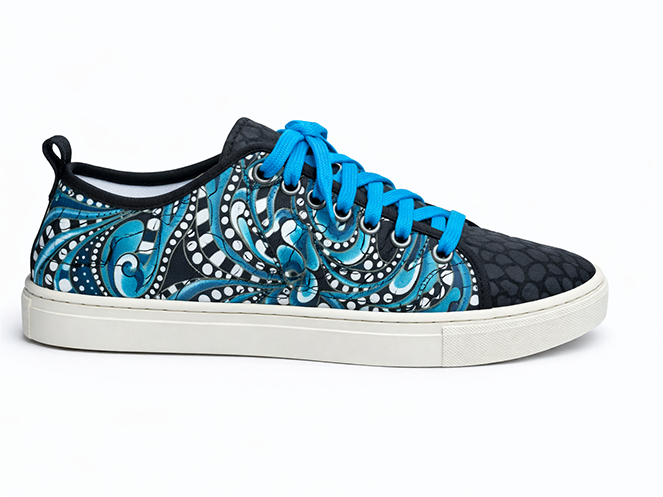 Blue Swirl Quilted Sneaker Quilted low-top sneaker with blue swirl pattern, black toe panel, blue laces, and white sole