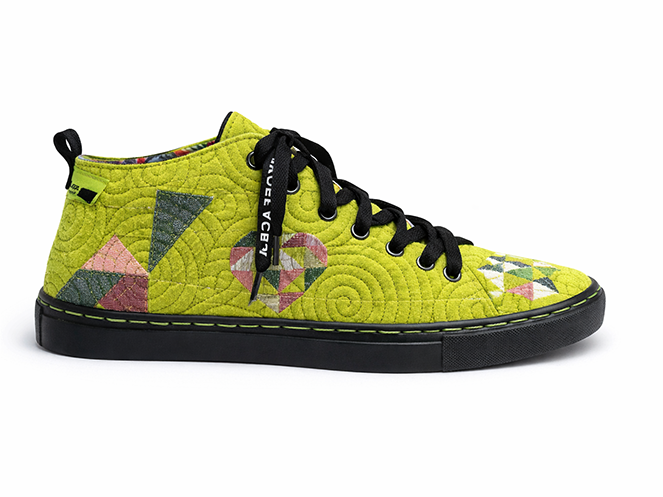 Lime Geometric Quilted High-Top Lime green quilted high-top sneaker with spiral stitching, geometric patches, black laces, and black sole
