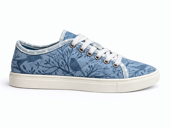 Blue Botanical Quilted Sneaker Light blue quilted sneaker with botanical and bird print, white laces, and white sole