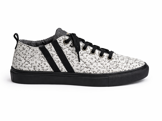 White Script Quilted Sneaker White quilted low-top sneaker with black script print, black side stripes, black laces, and black sole