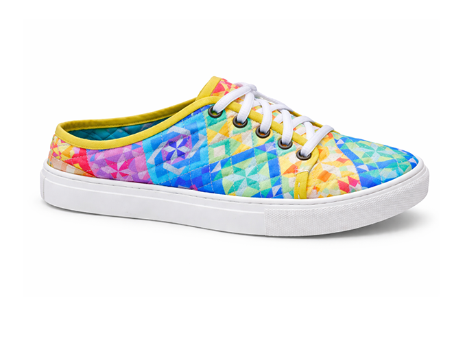 Rainbow Geometric Quilted Sneaker Bright rainbow quilted sneaker with geometric prism pattern, yellow trim, and white laces