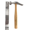 Close-up of a hammer head with a wooden handle. The hammer head is stamped with the text "C.S. OSBORNE & CO 65 MADE IN USA FORGED STEEL". The hammer is made of metal and wood.